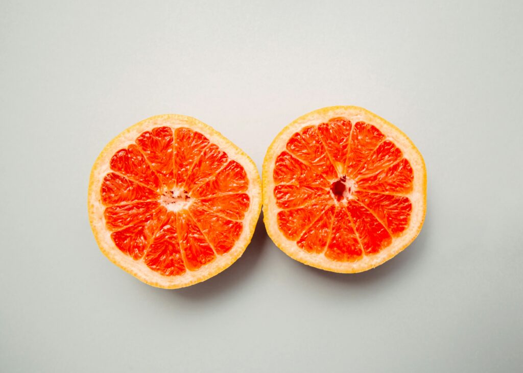 two open grapefruits halves representing how TCM supports breast health